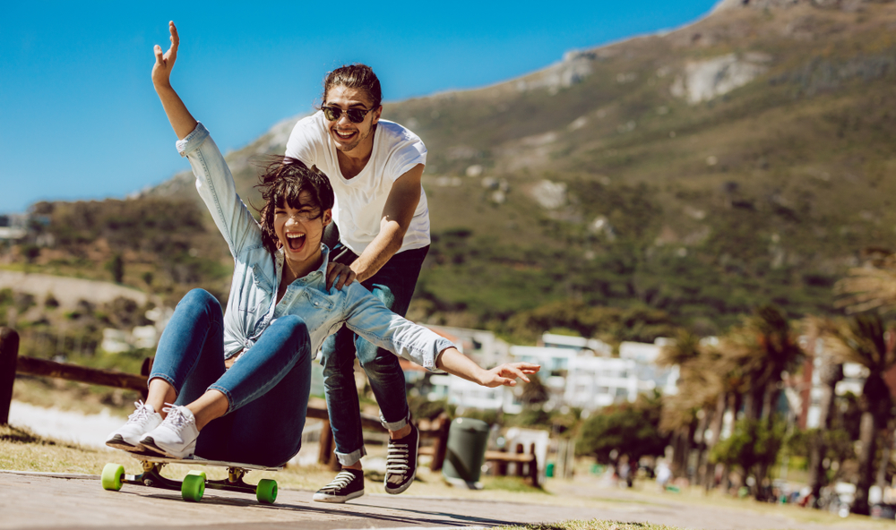 Two friends enjoying doing the skateboard